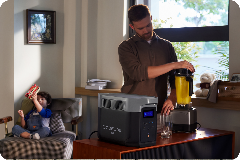 A father uses EcoFlow DELTA 2 to power a juicer to make juice for his son.